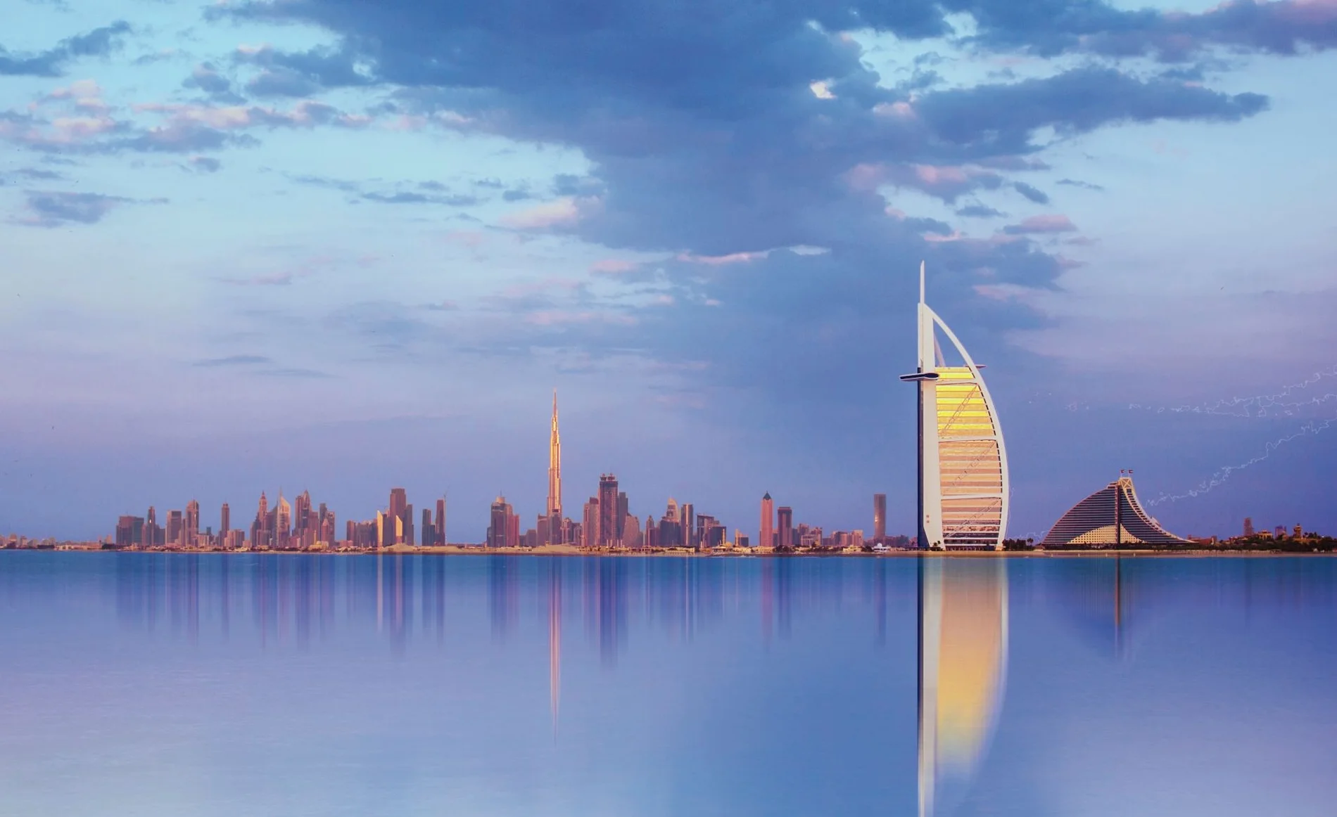 Luxury Dubai skyline with Burj Al Arab hotel representing premium hotel bedding quality